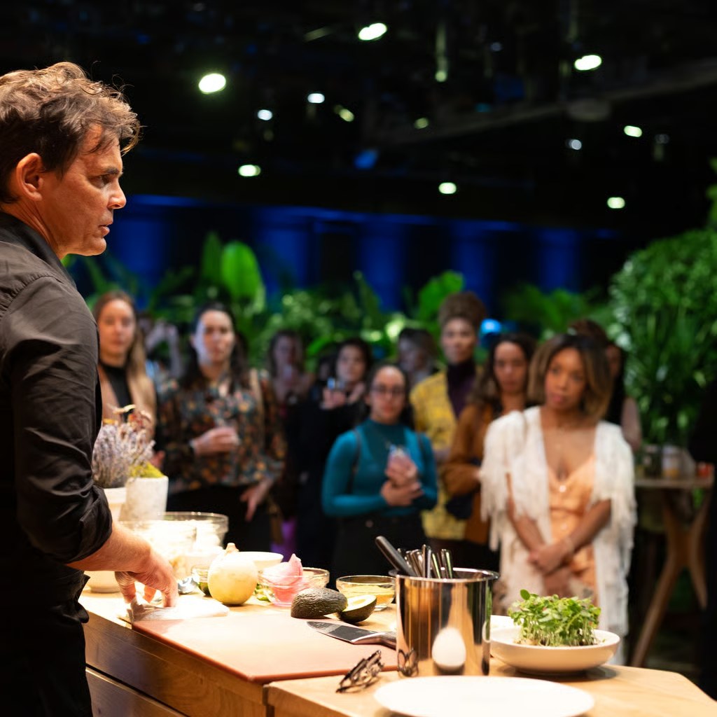 Chef Matthew Kenney cooking for guests