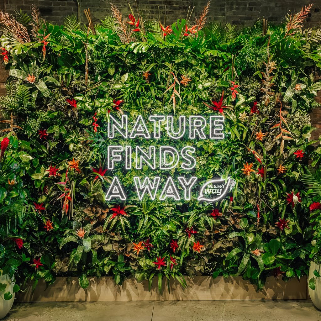 Nature Finds A Way in neon on a living wall