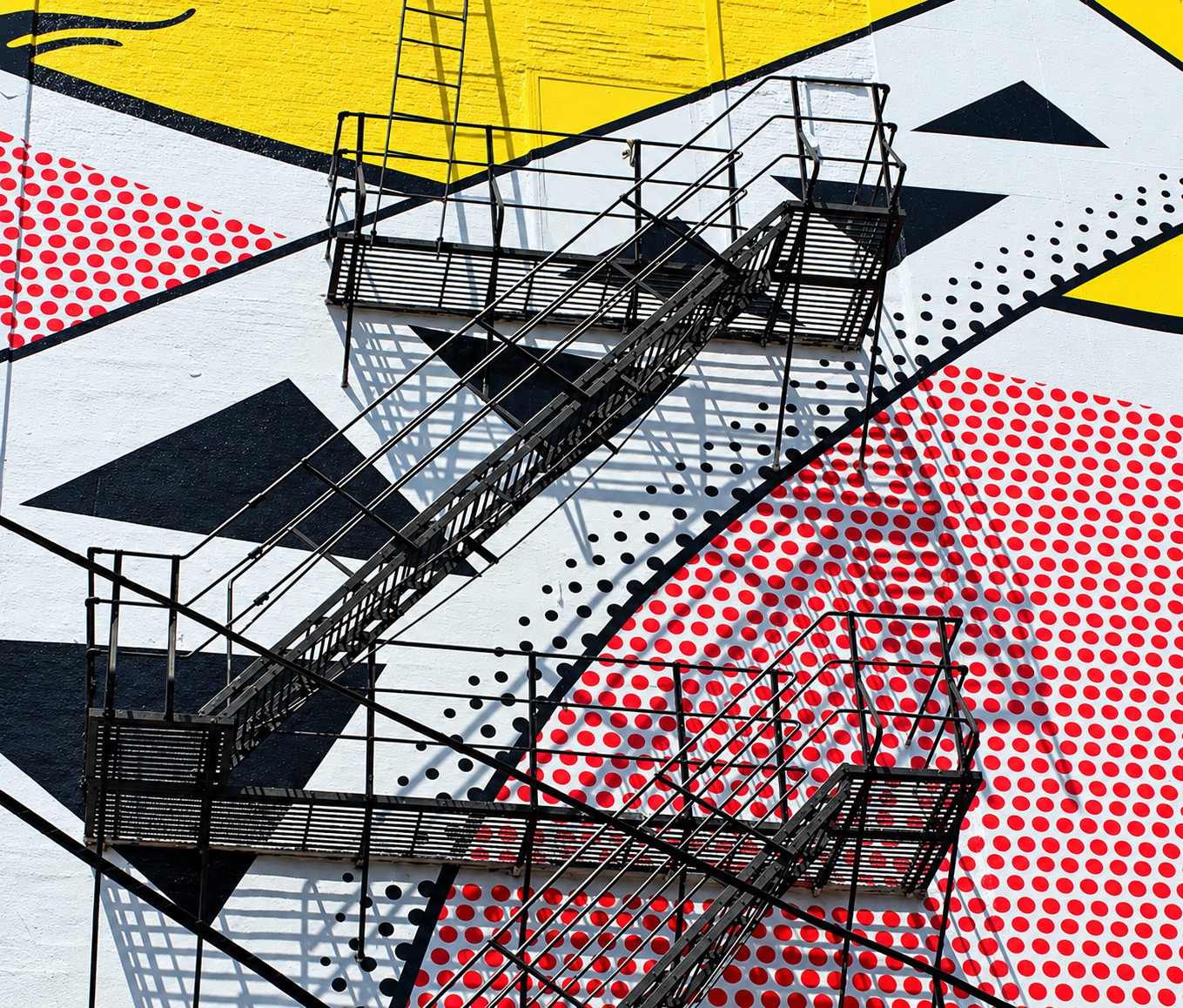 Fire escapes cutting across the dots and triangles